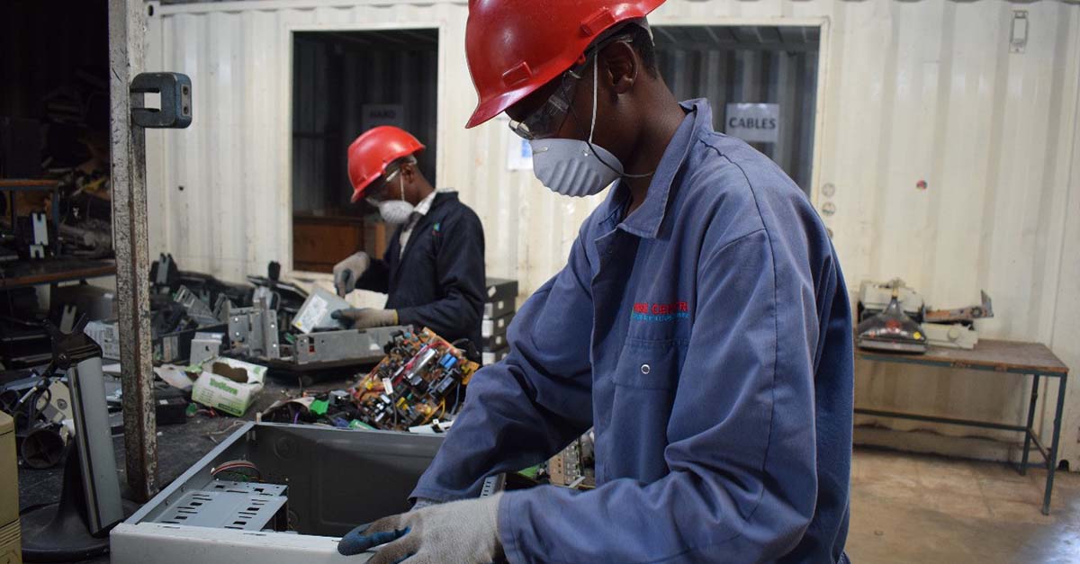 Two employees working on Electrical and Electronic Equipment (EEE) in Kenya
