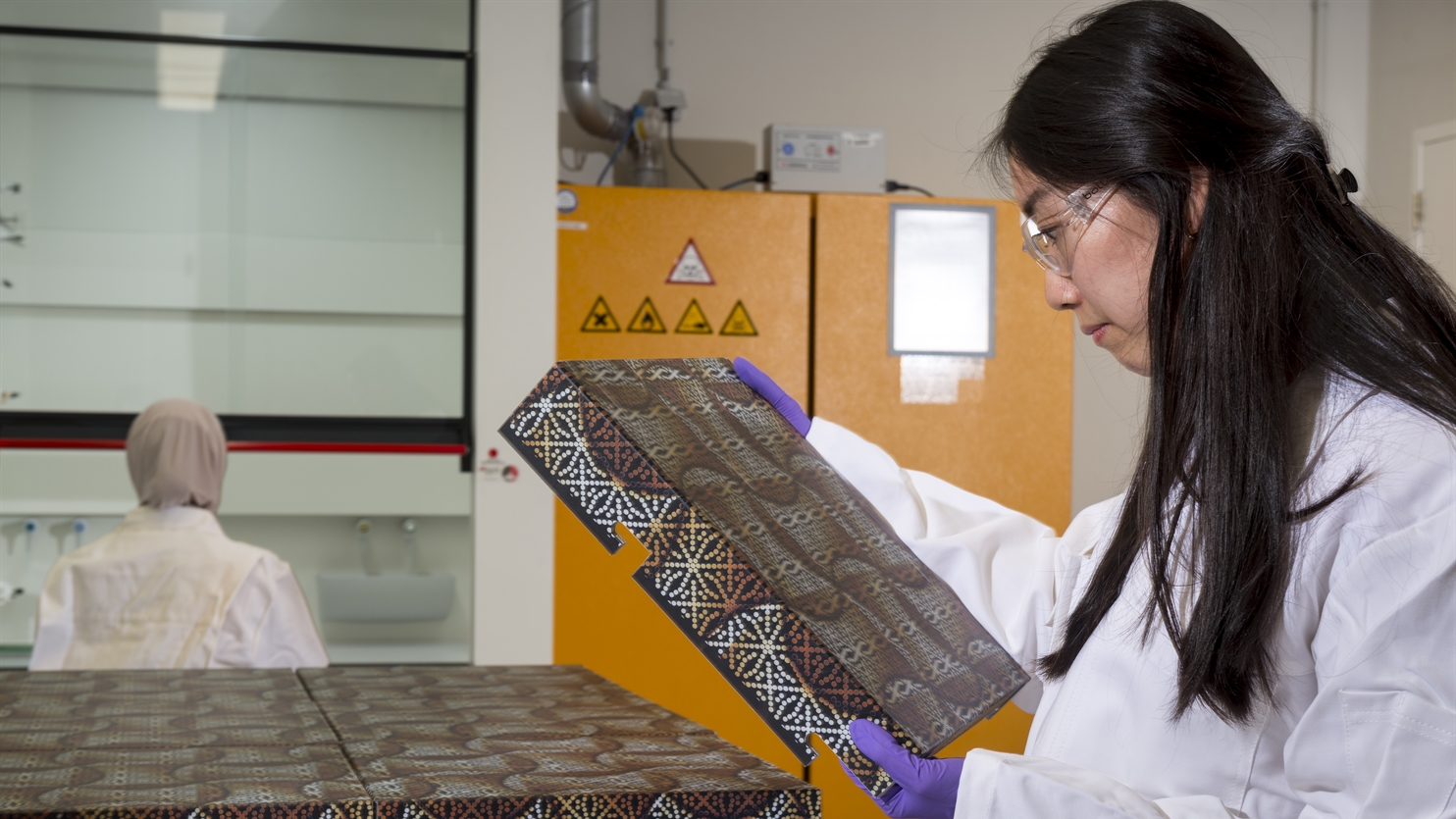 Scientist holding silicon solar cell