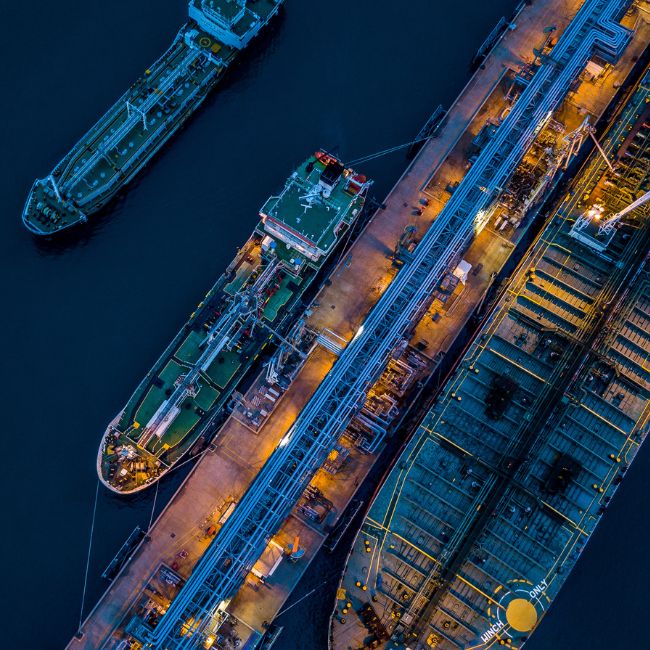 Ships in harbour by night